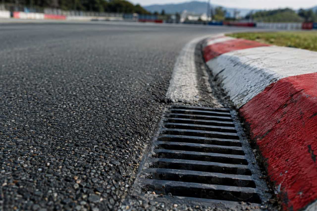 Drainage grate near the track's outer kerb