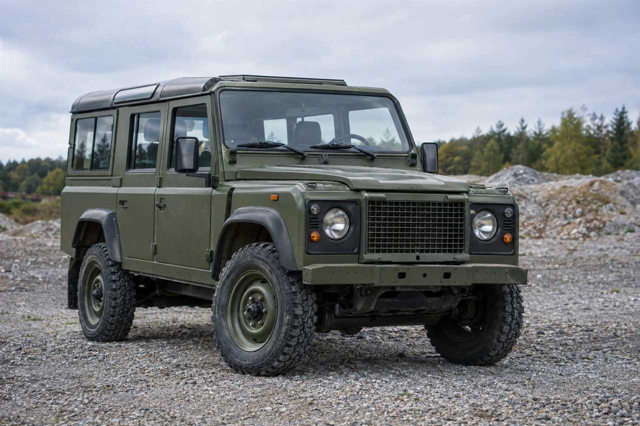 Military-style off-road vehicle on gravel terrain