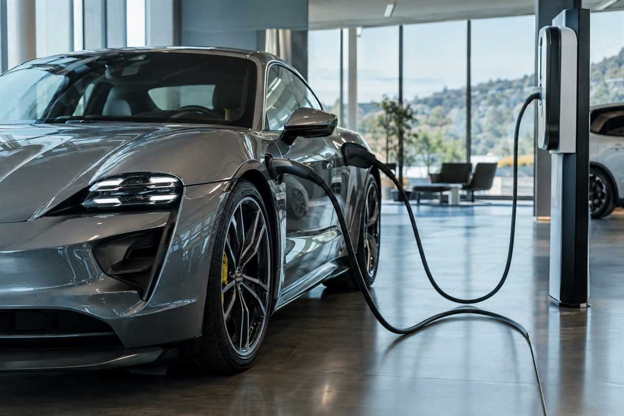 Electric sports car charging in showroom