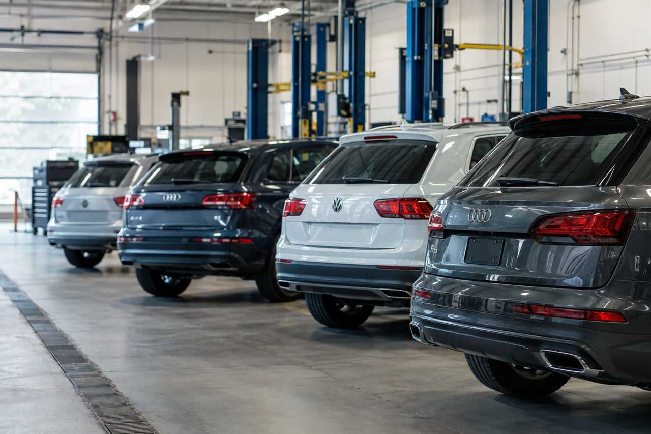 SUVs lined up at dealership for recall inspections.