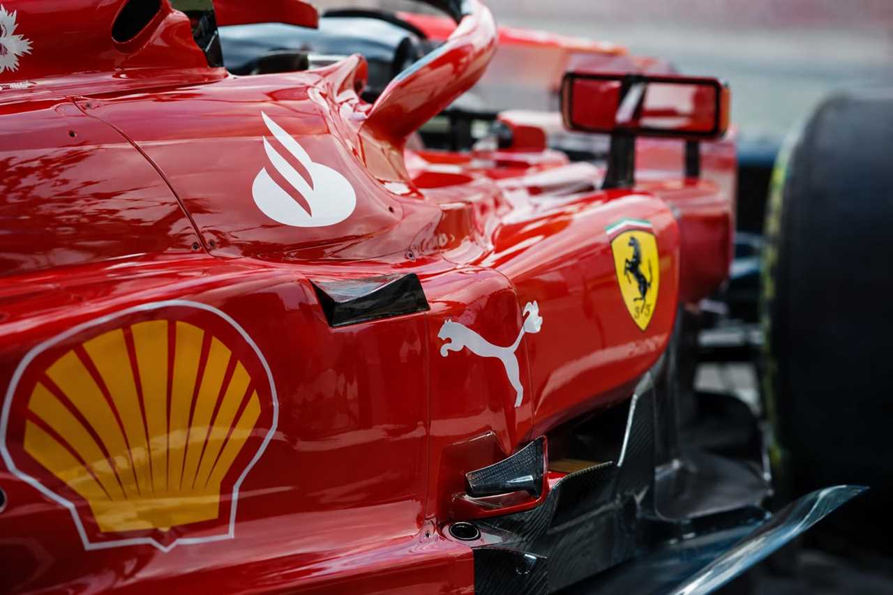 Sponsor branding covers a Formula 1 car's bodywork.