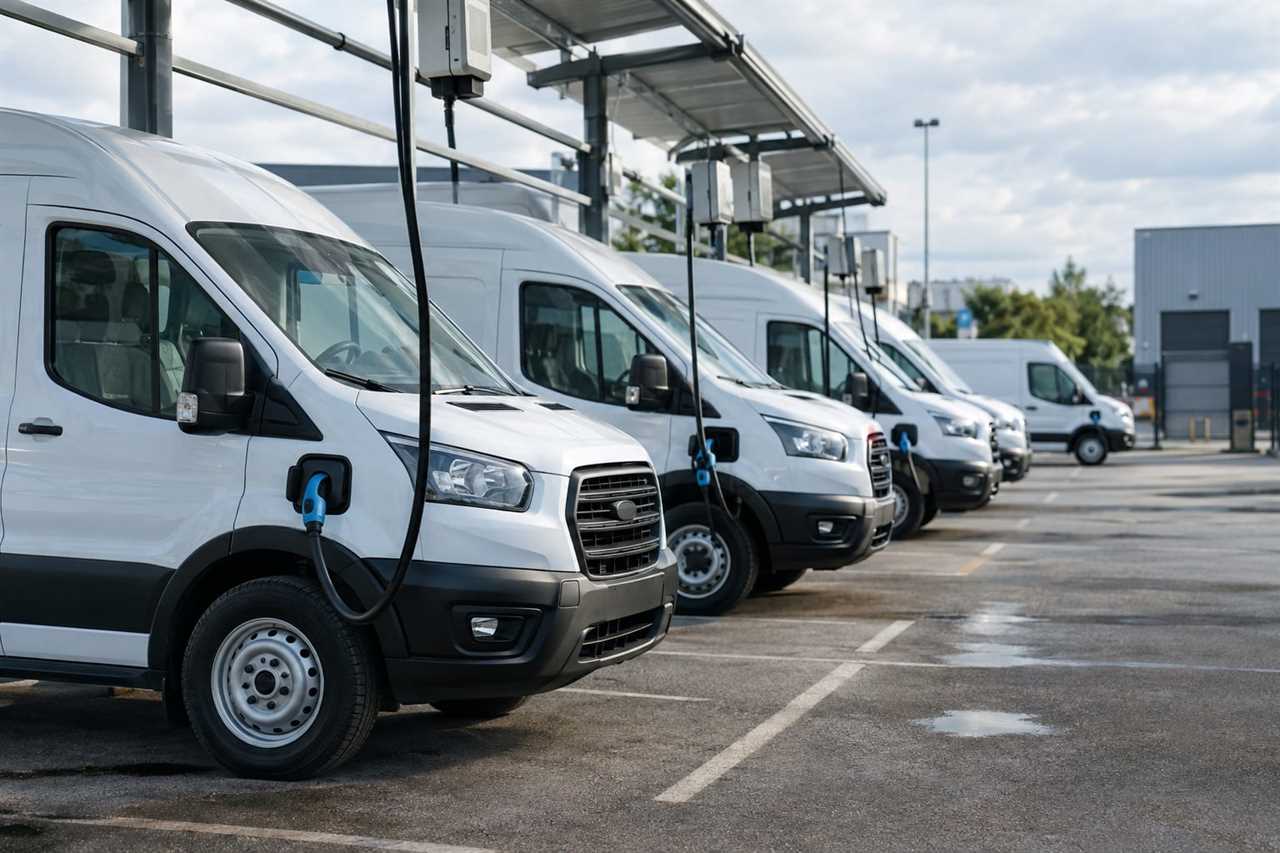 Fleet vans charging at a depot