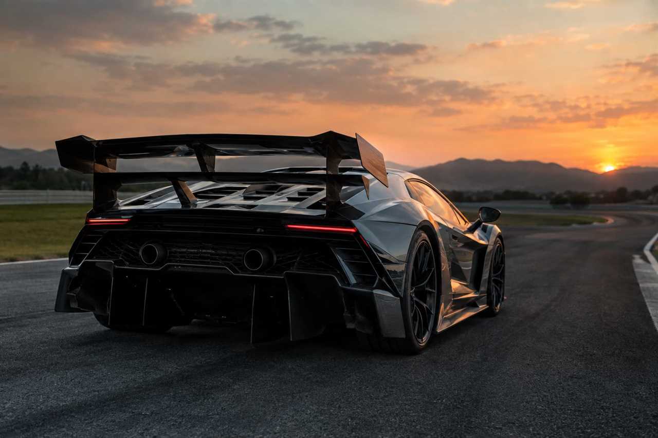 Hypercar's rear spoiler and aerodynamic vents on track