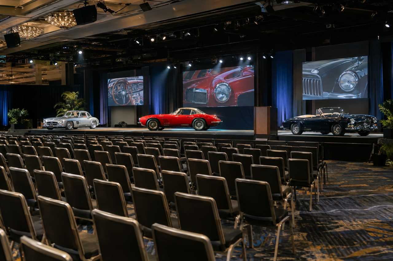 An auction hall prepared for a classic car sale
