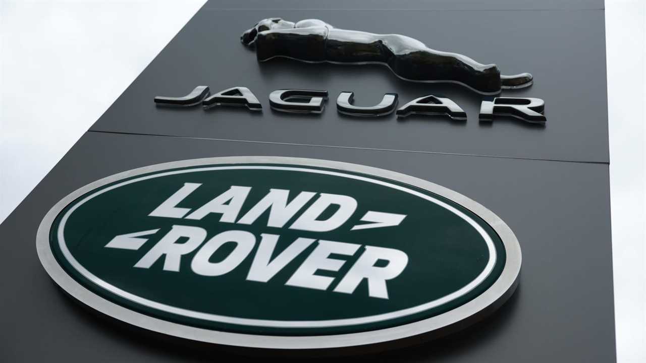 A large grey sign with the Jaguar and Land Rover signs