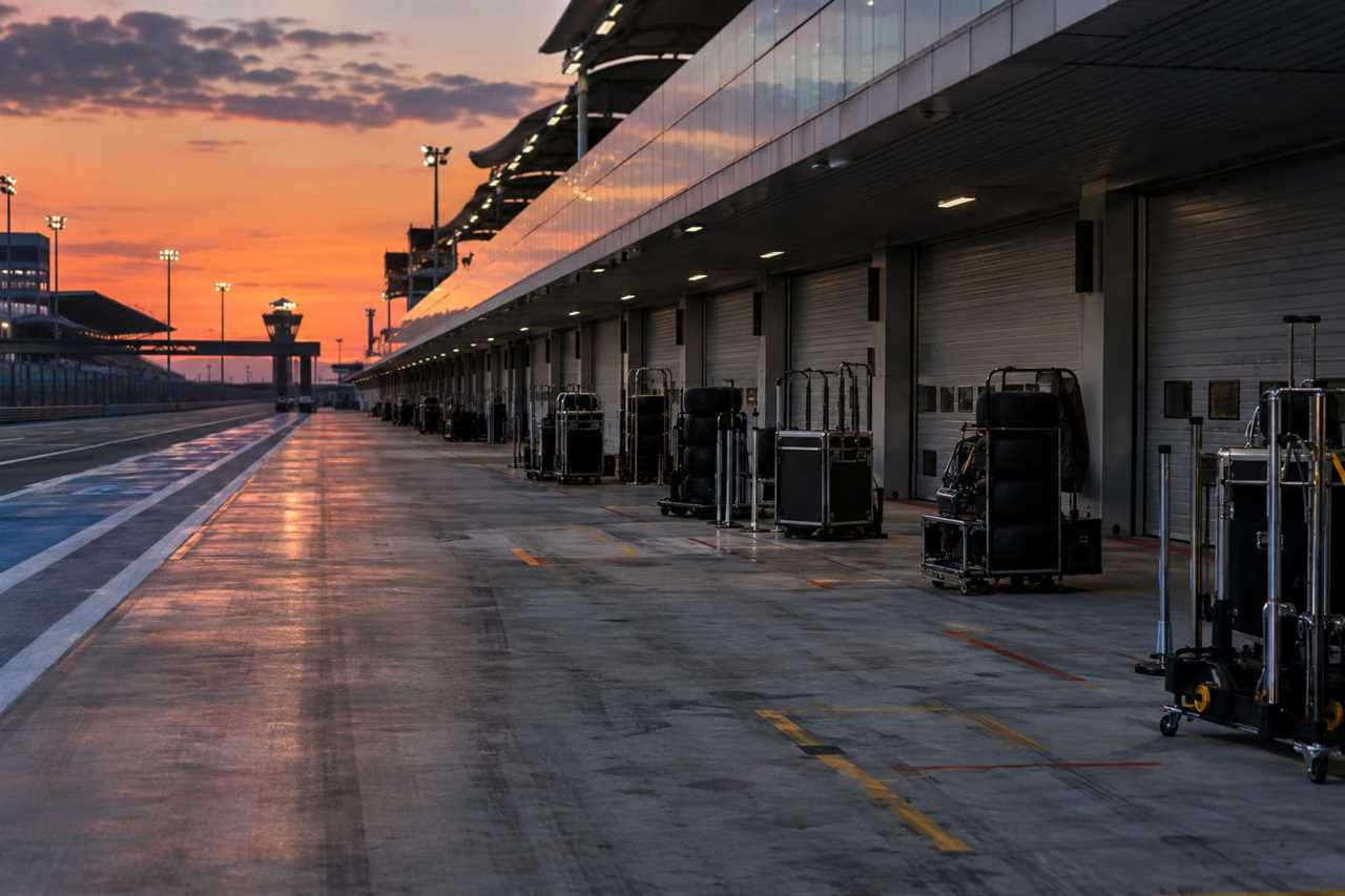 Empty pit lane reflects a team under quiet pressure