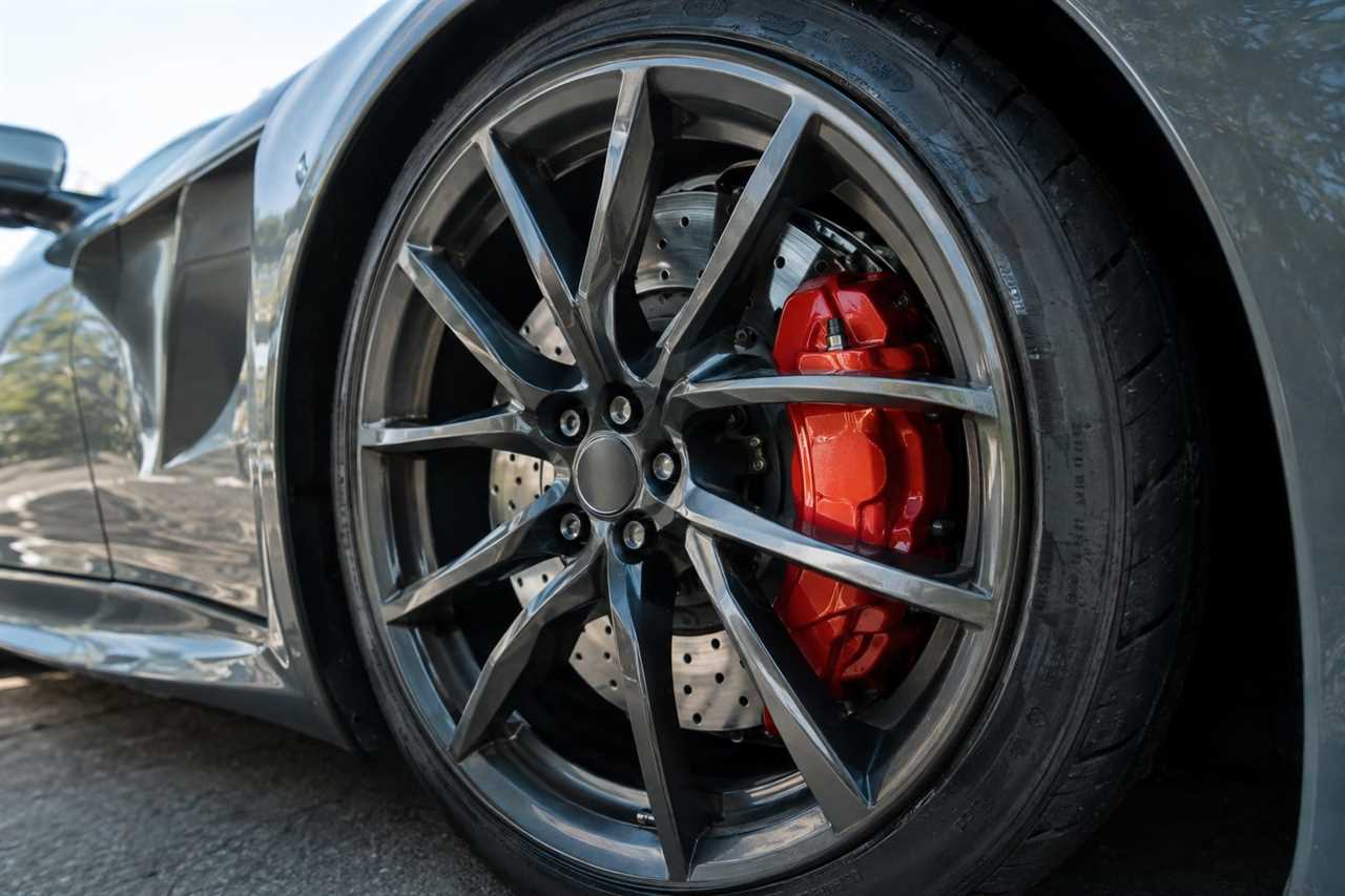Close-up of a sports car wheel and brake caliper.