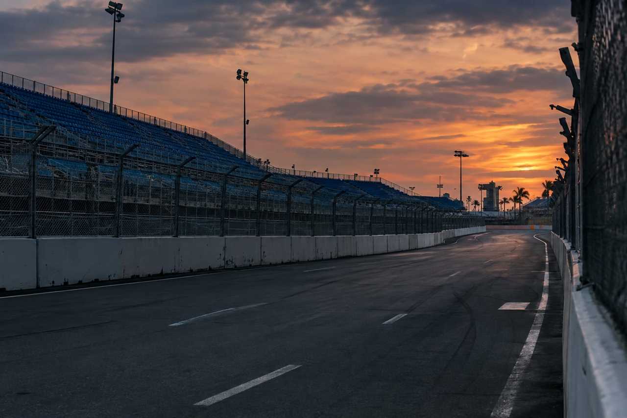 Empty grandstands line a street circuit