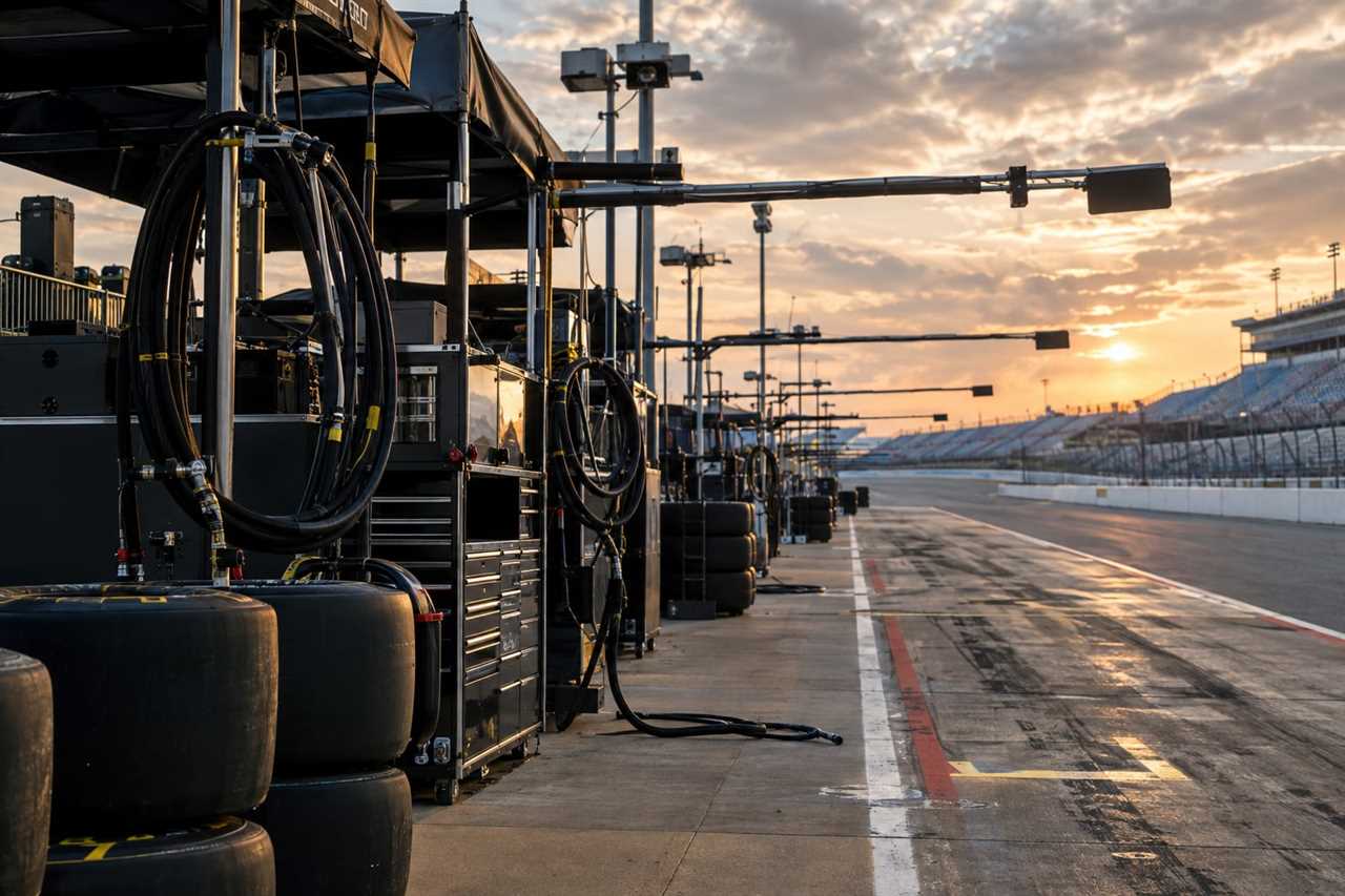 Empty pit lane with tires and fuel equipment ready