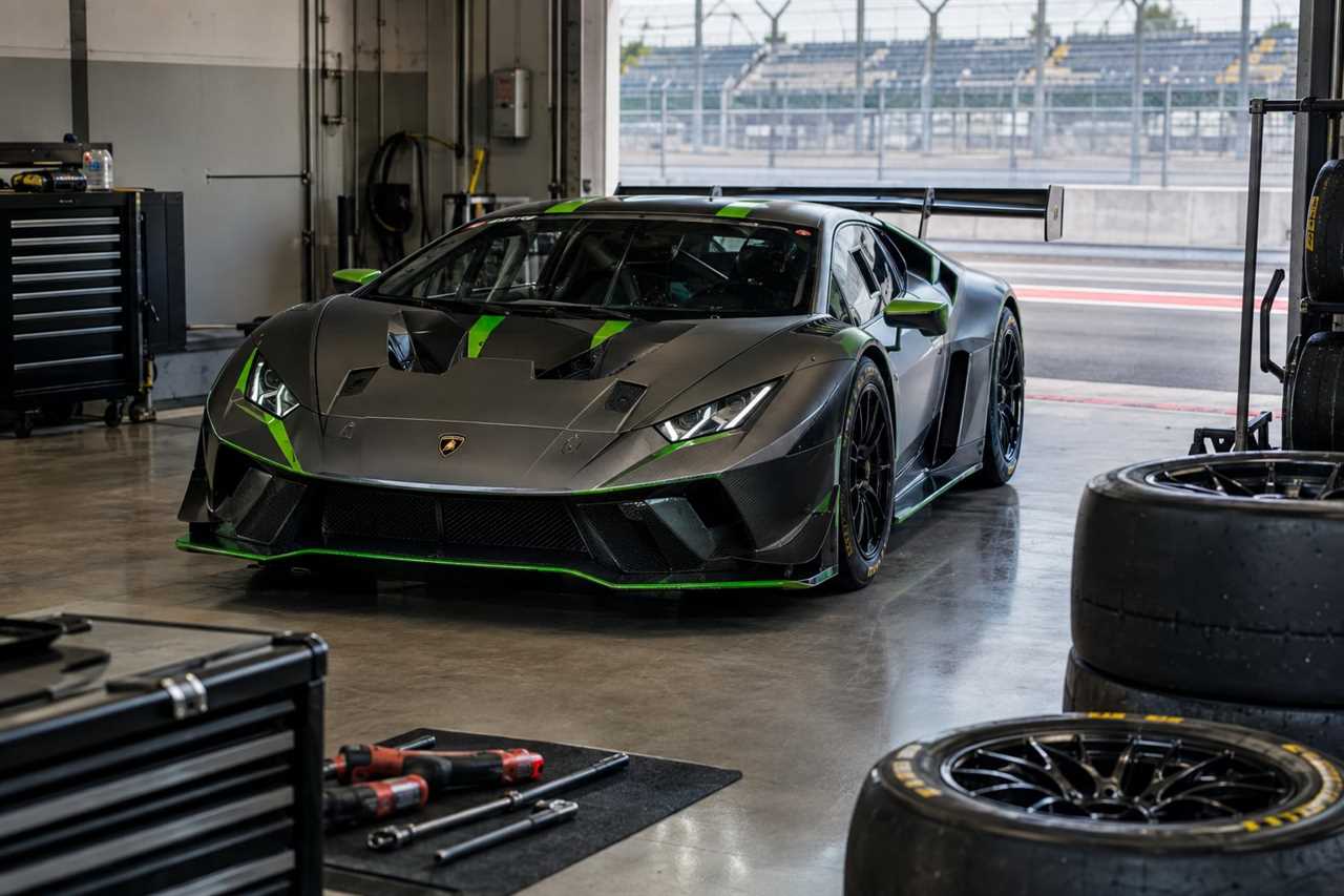 New Lamborghini GT race car in pit garage
