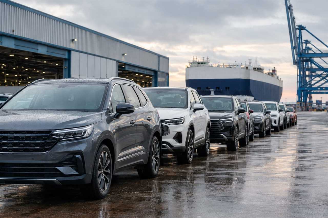 New vehicles await shipment at a UK distribution yard