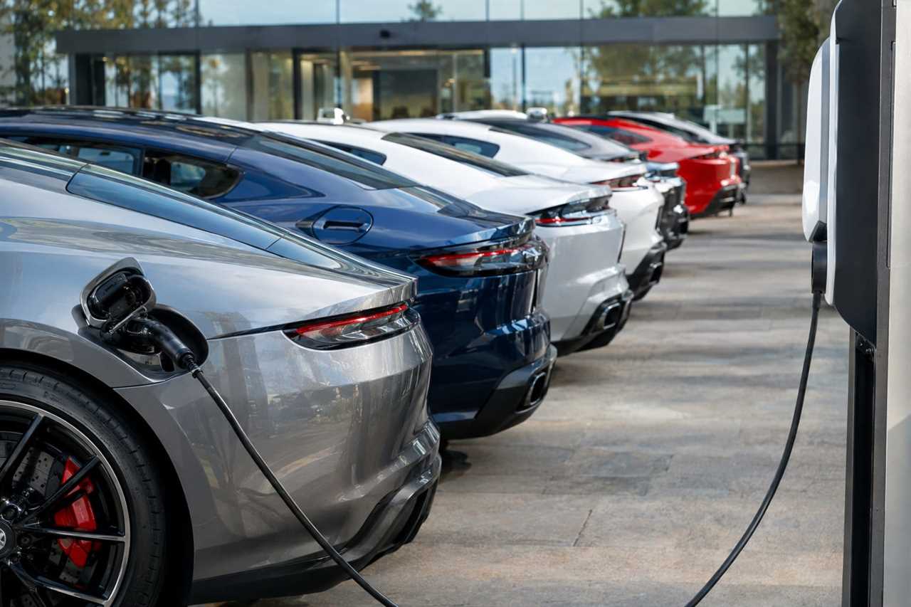 Petrol and electric sports cars parked side by side