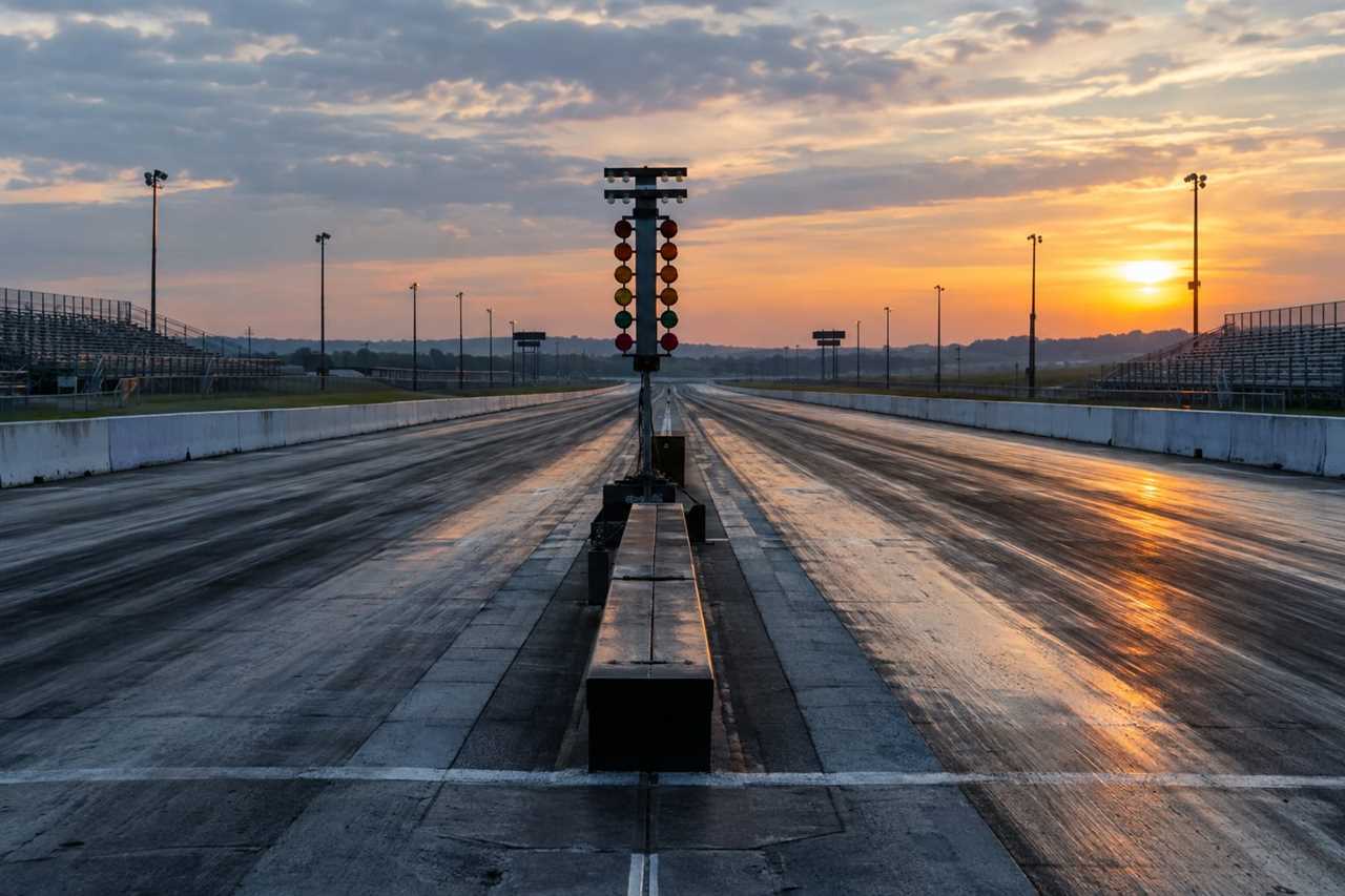 Empty drag strip timing lights at sunrise