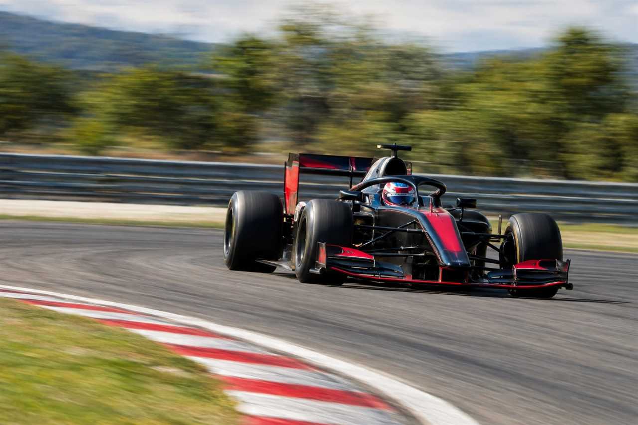Race car powering through a fast circuit corner