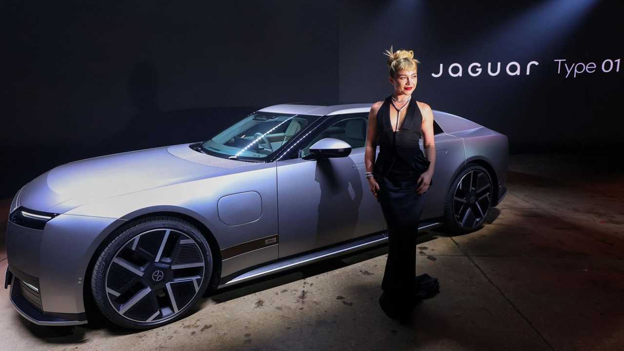 Florence Pugh poses next to a Jaguar Type 01 during the car's launch event at Storied NYC on October 06, 2026 in New Yor