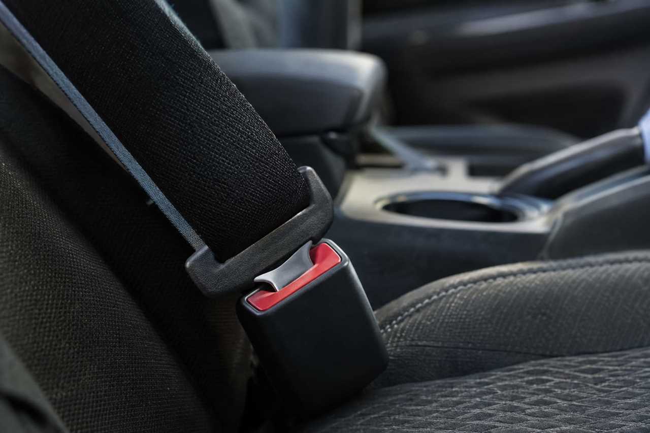 Properly fastened seat belt webbing and buckle