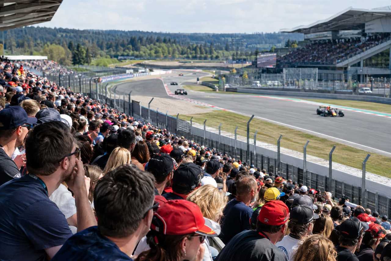Spectators fill the grandstands on race day.