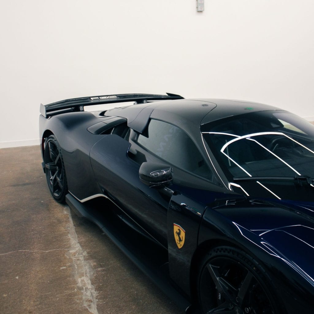 First Ferrari F80 arrives in Dallas wearing a wild color-shifting paint job that changes from blue to green