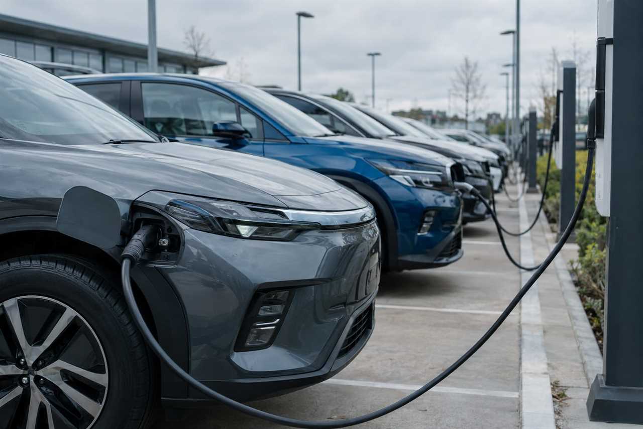 Electric vehicles charging at a UK dealership