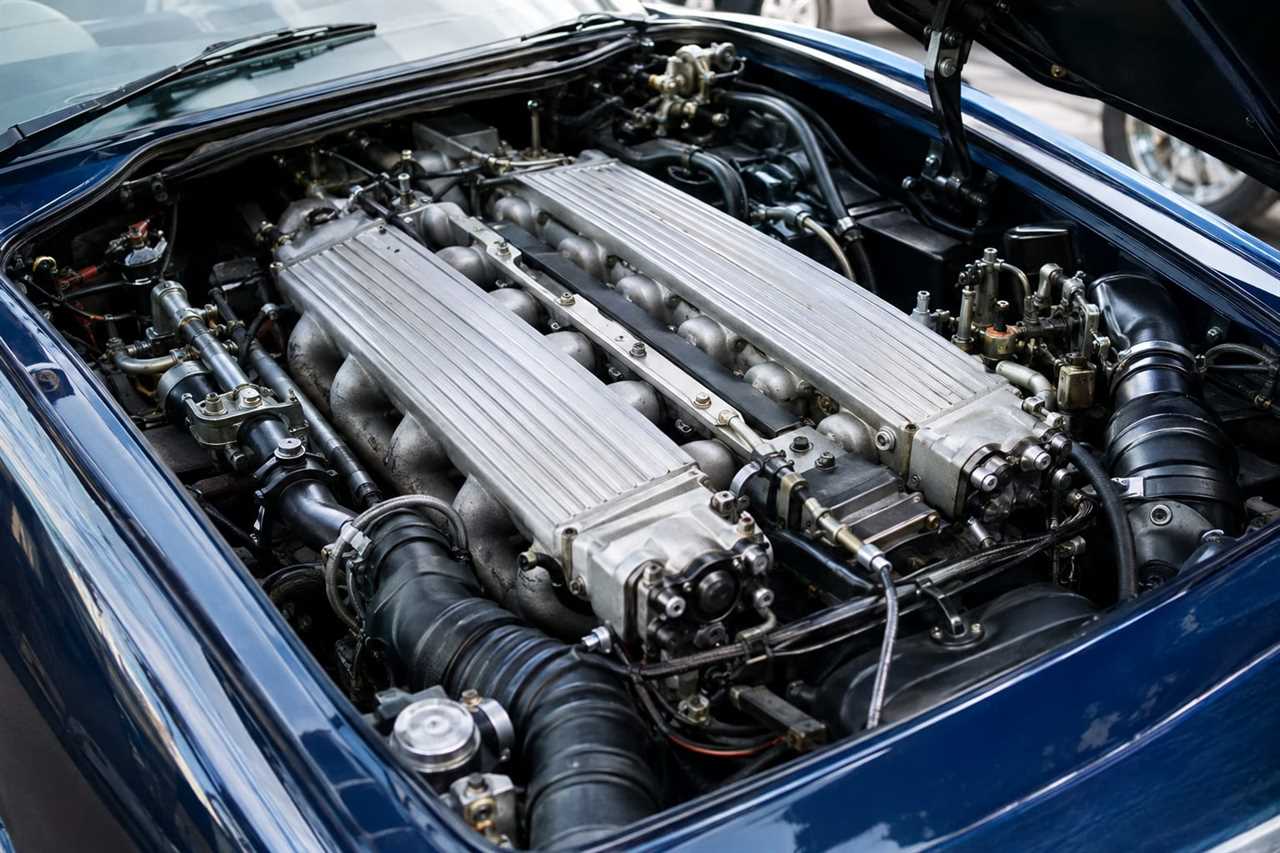 Analog V12 engineering defines classic supercar heritage.