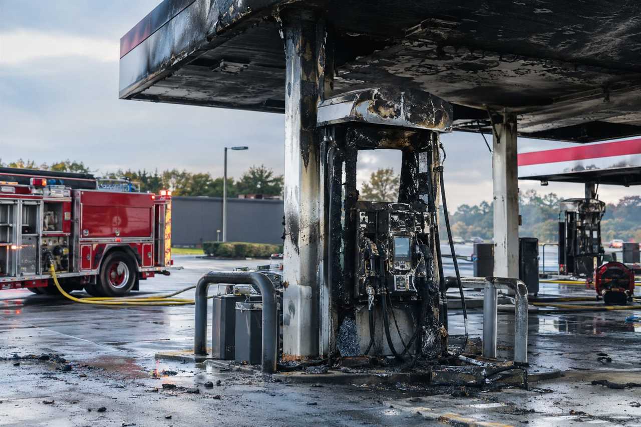 Fire-damaged fuel pump and canopy at gas station
