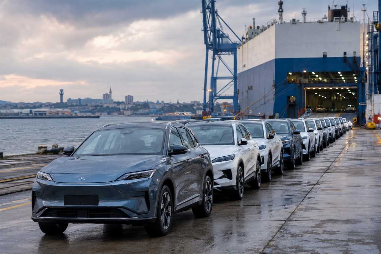 Imported electric vehicles await distribution at a UK port