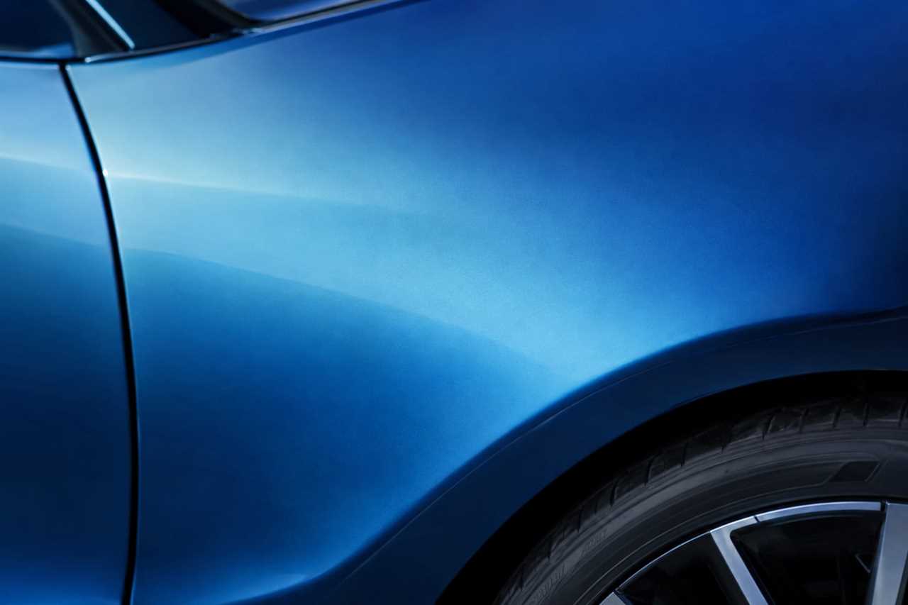 Gradient blue paint finish transitioning across a car body
