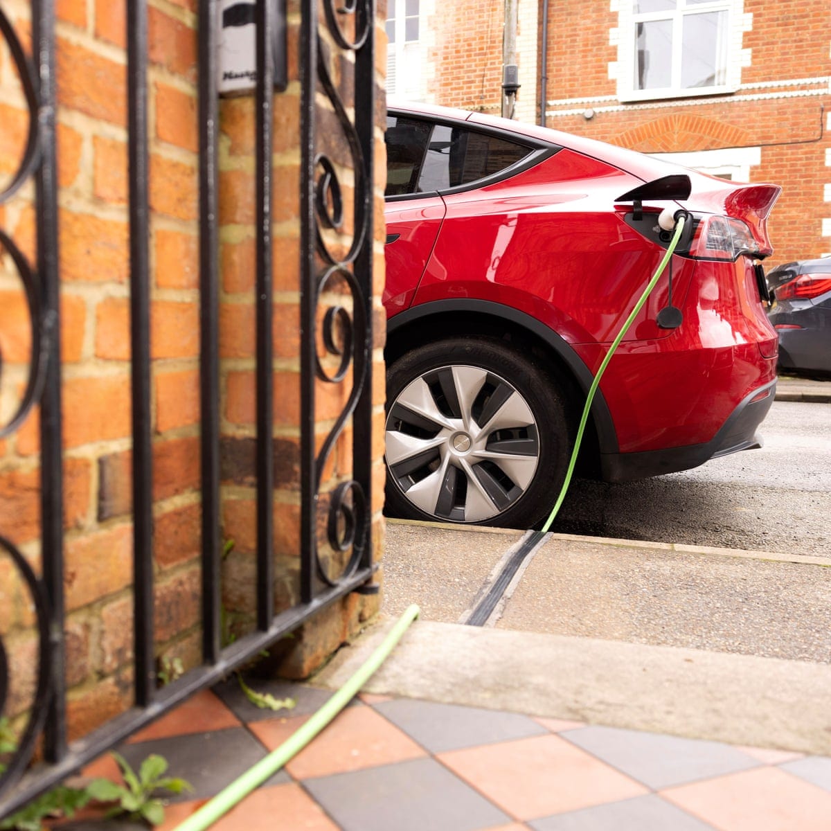 ‘I can charge my car for £6’: could new rules cut costs for EV drivers?