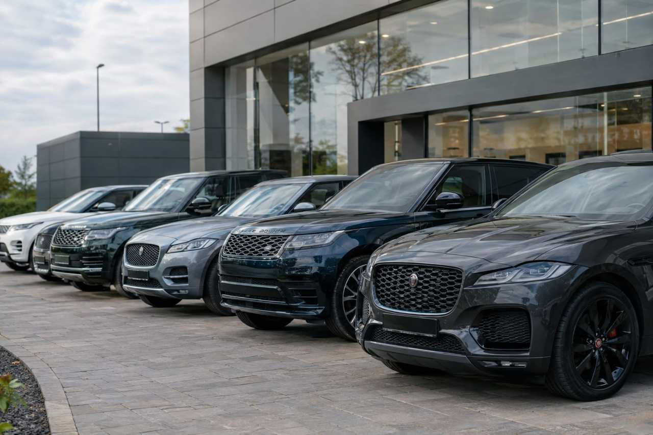 Dealership forecourt stocked with luxury vehicles
