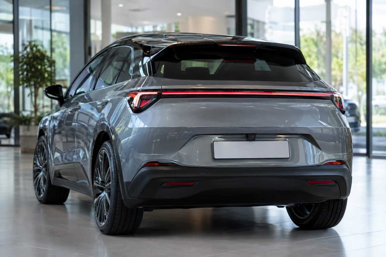 Compact EV with sloped roofline and rear spoiler
