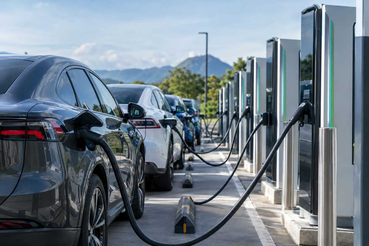 Electric vehicles charging at a roadside station