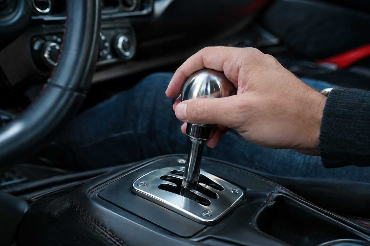 A manual gearshift inside a performance car