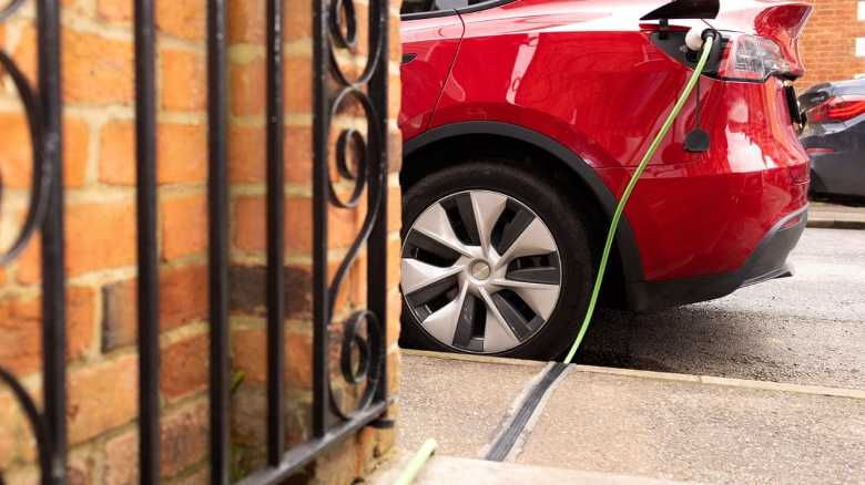 ‘I can charge my car for £6’: could new rules cut costs for EV drivers?